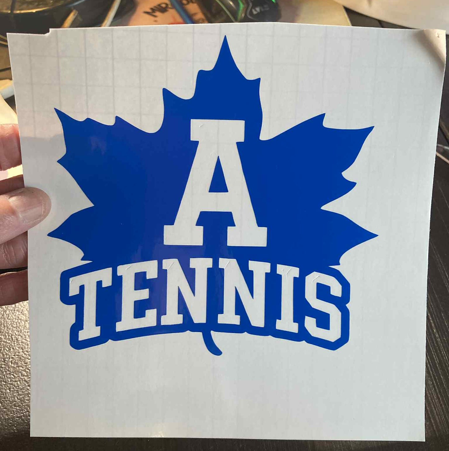 Blue Adrian Maples tennis decal featuring a maple leaf with large “A Tennis” text – durable vinyl for cars, laptops, water bottles, and team spirit gear
