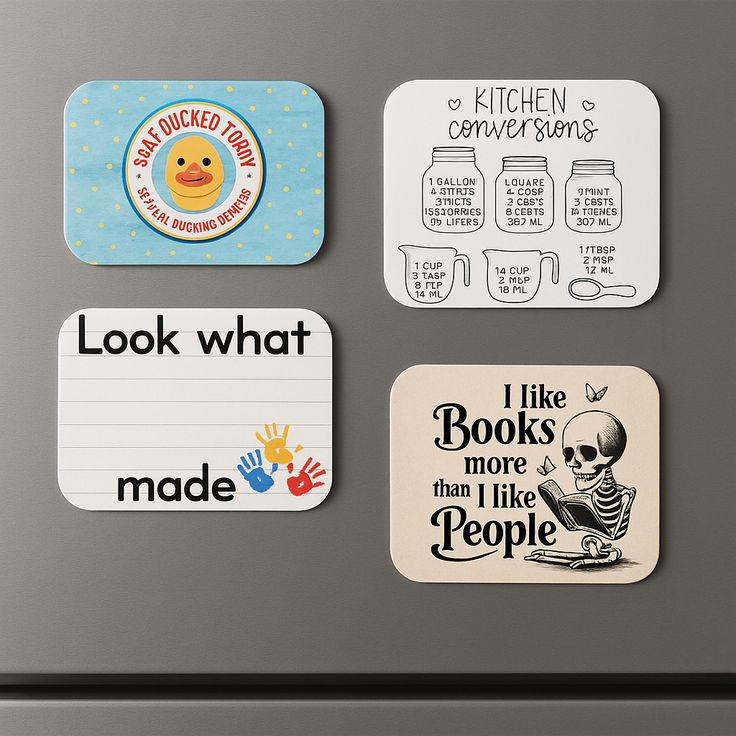 Four decorative coasters with various designs on a gray surface