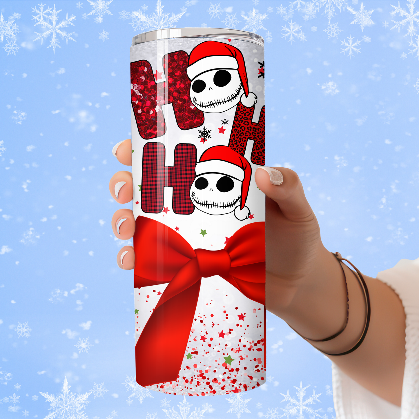 Tumbler with Christmas design featuring a skeleton wearing a Santa hat against a snowy background