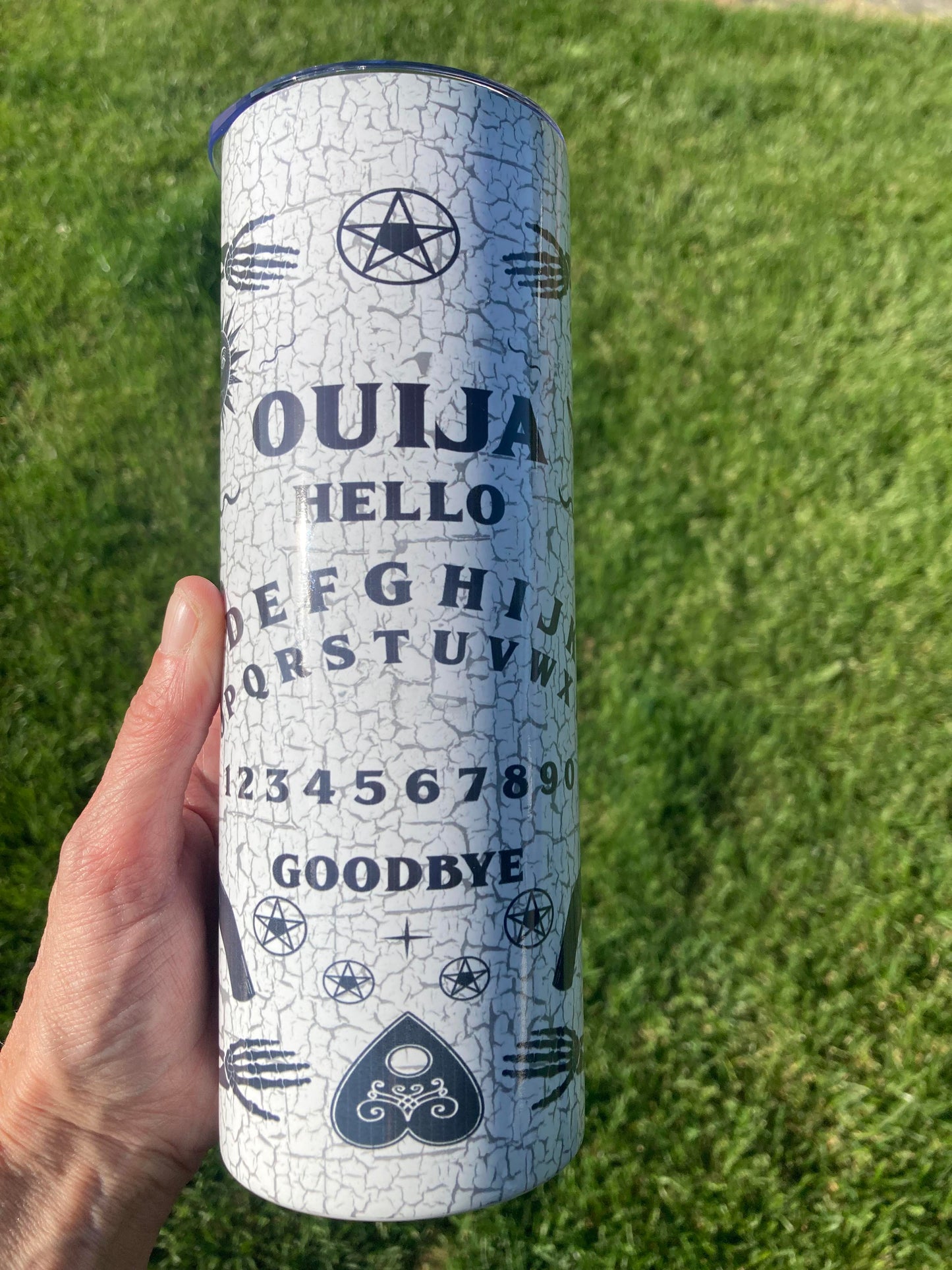 Spooky Ouija board themed Halloween tumbler, 20oz insulated skinny stainless steel cup with planchette design and straw.