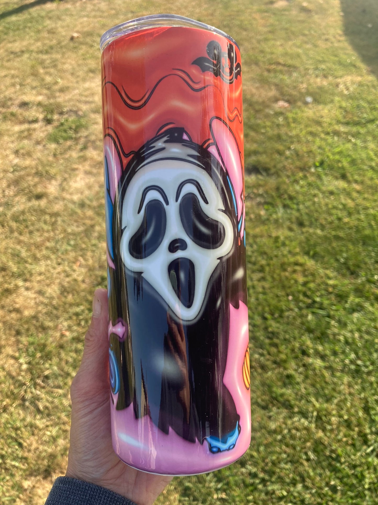 Scream ghost tumbler with pink drip background and colorful spooky aesthetic design