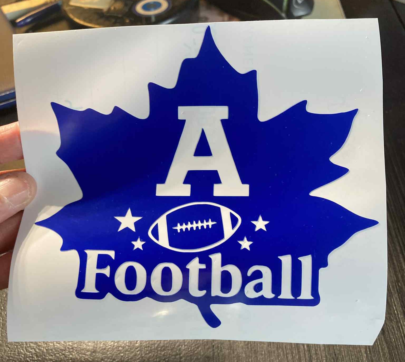 Blue Adrian Maples football decal with maple leaf, large “A,” football graphic, and stars – durable vinyl for cars, laptops, water bottles, and spirit gear