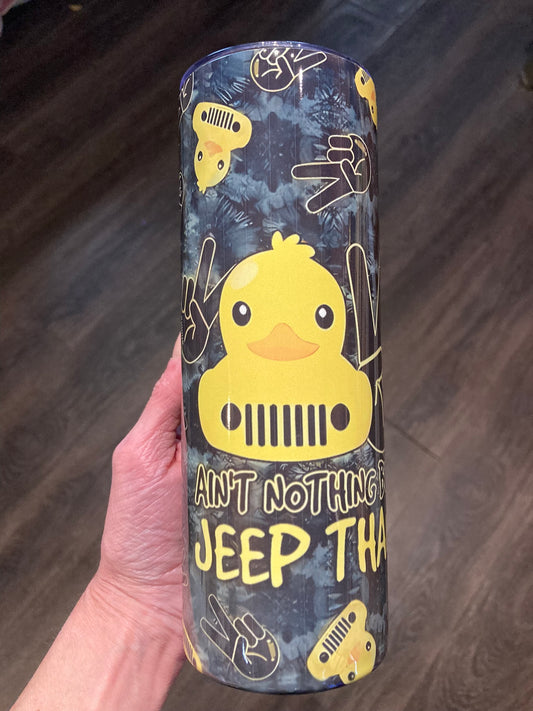 Tumbler with a yellow rubber duck design and text on a dark background. Jeep duck tumbler with yellow rubber duck, Jeep grille, peace hand sign, and the quote “Ain’t Nothing But a Jeep Thang.”