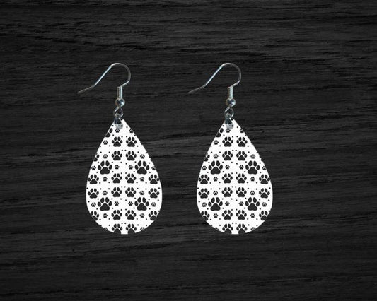 teardrop shaped; black and white dog paw print earrings