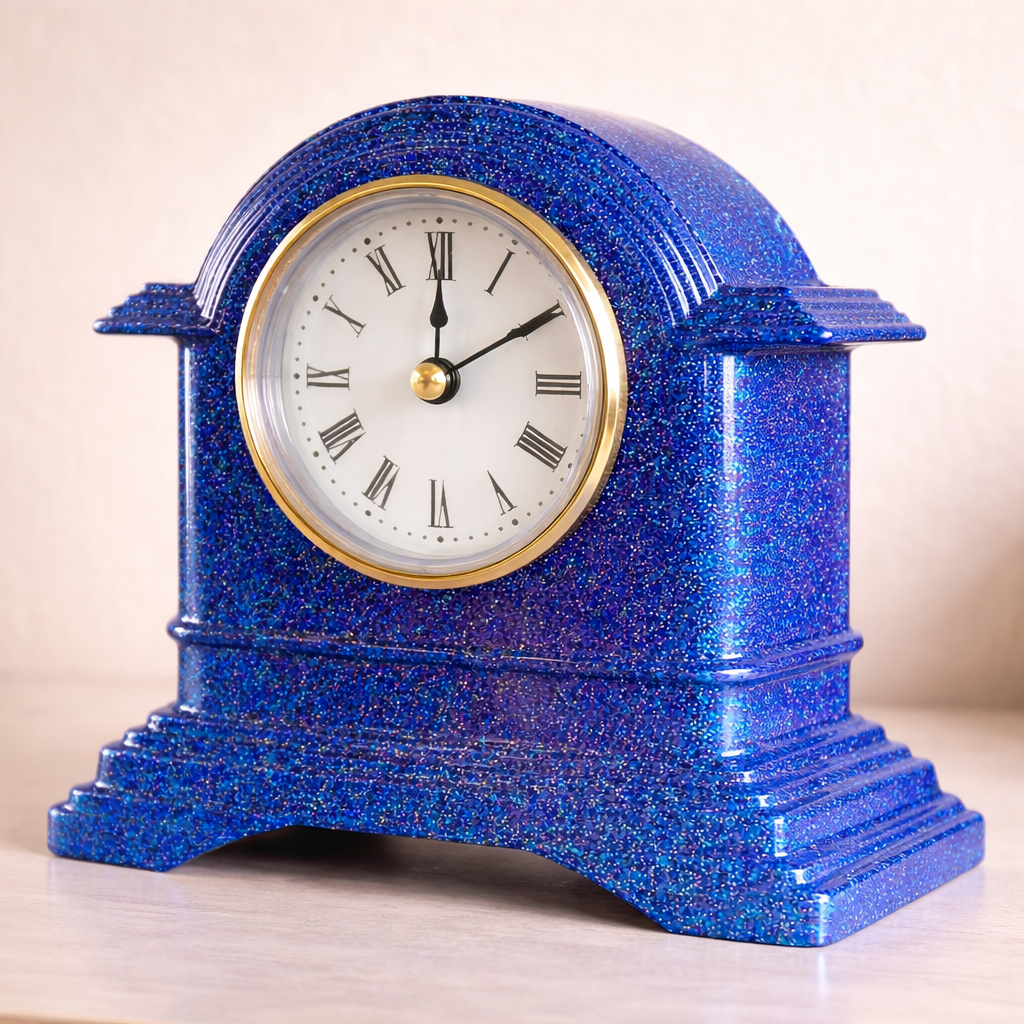 Blue glittery clock with white face and black hands on a beige background