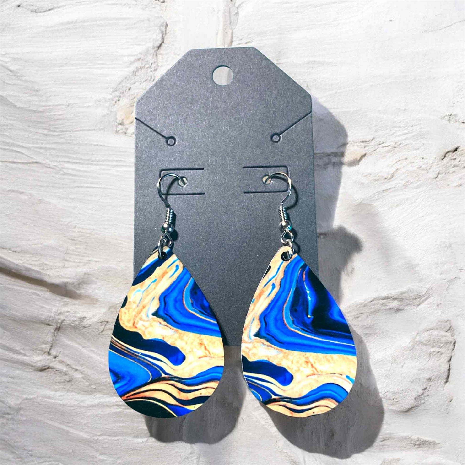 Teardrop earrings with blue and gold marble swirl sublimation artwork