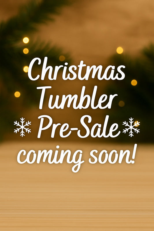 Promotional text for Christmas tumbler pre-sale with blurred lights and tree in the background.