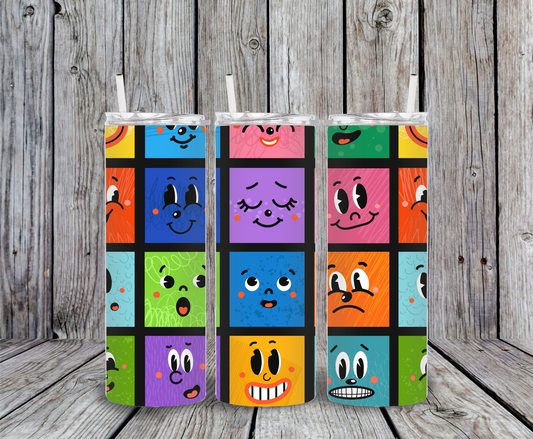 Colorful emoji tumbler – 20oz stainless steel insulated cup with fun cartoon faces in bright blocks, includes straw and slide-close lid.
