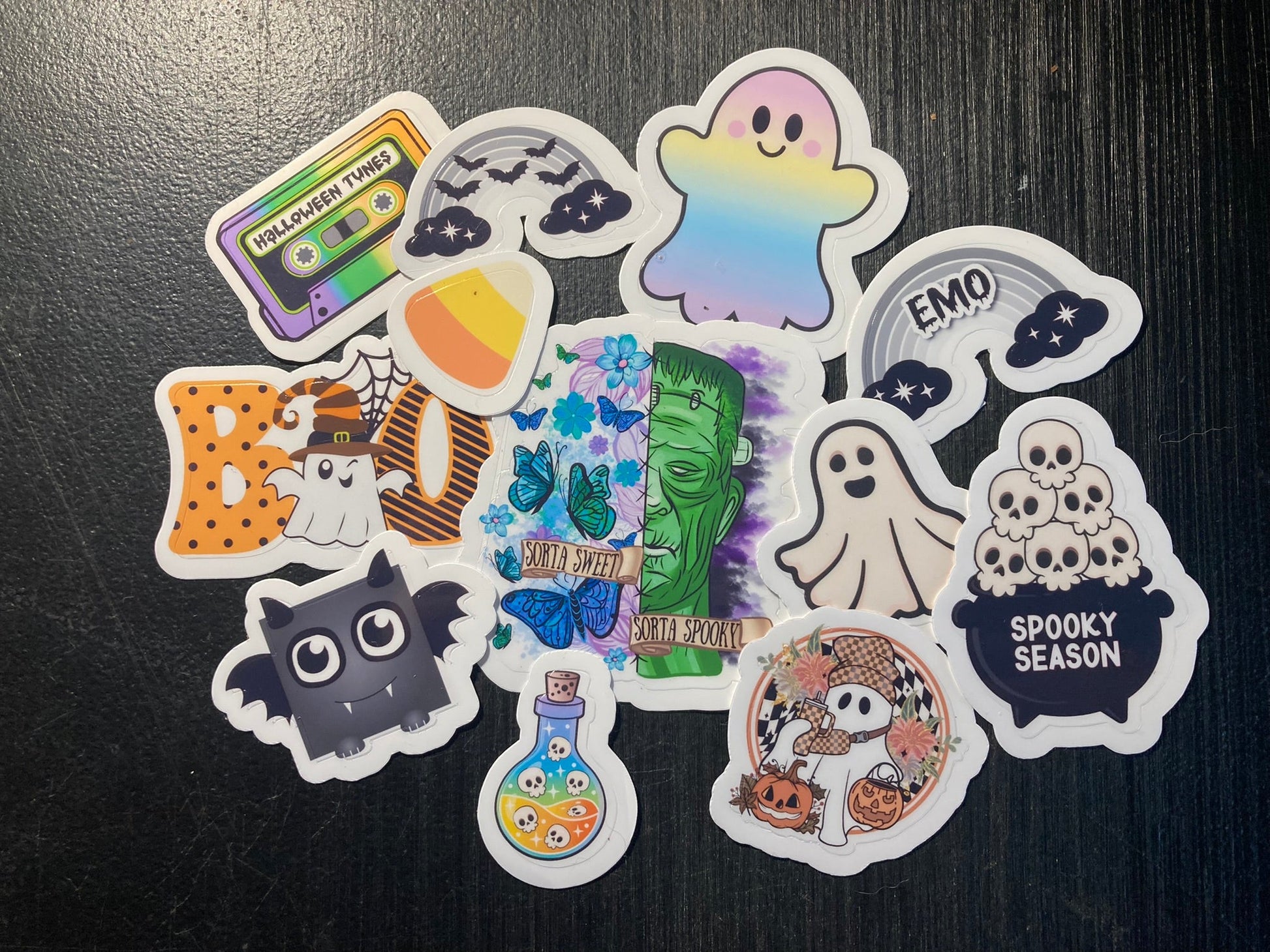 Collection of Halloween-themed stickers on a dark surface