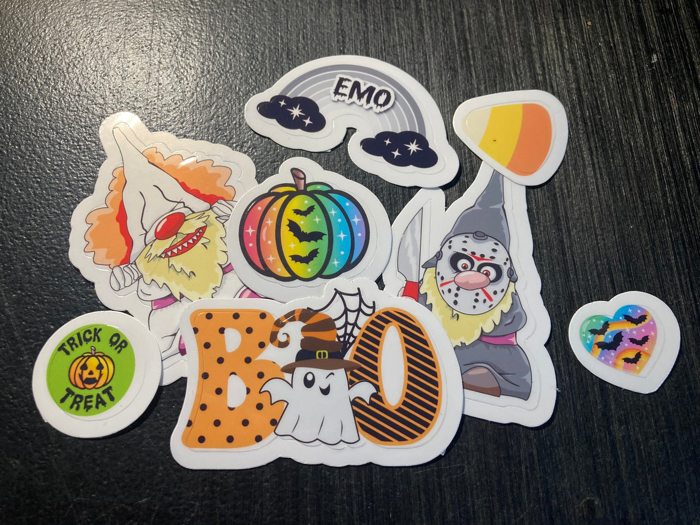 Set of Halloween-themed stickers on a dark surface