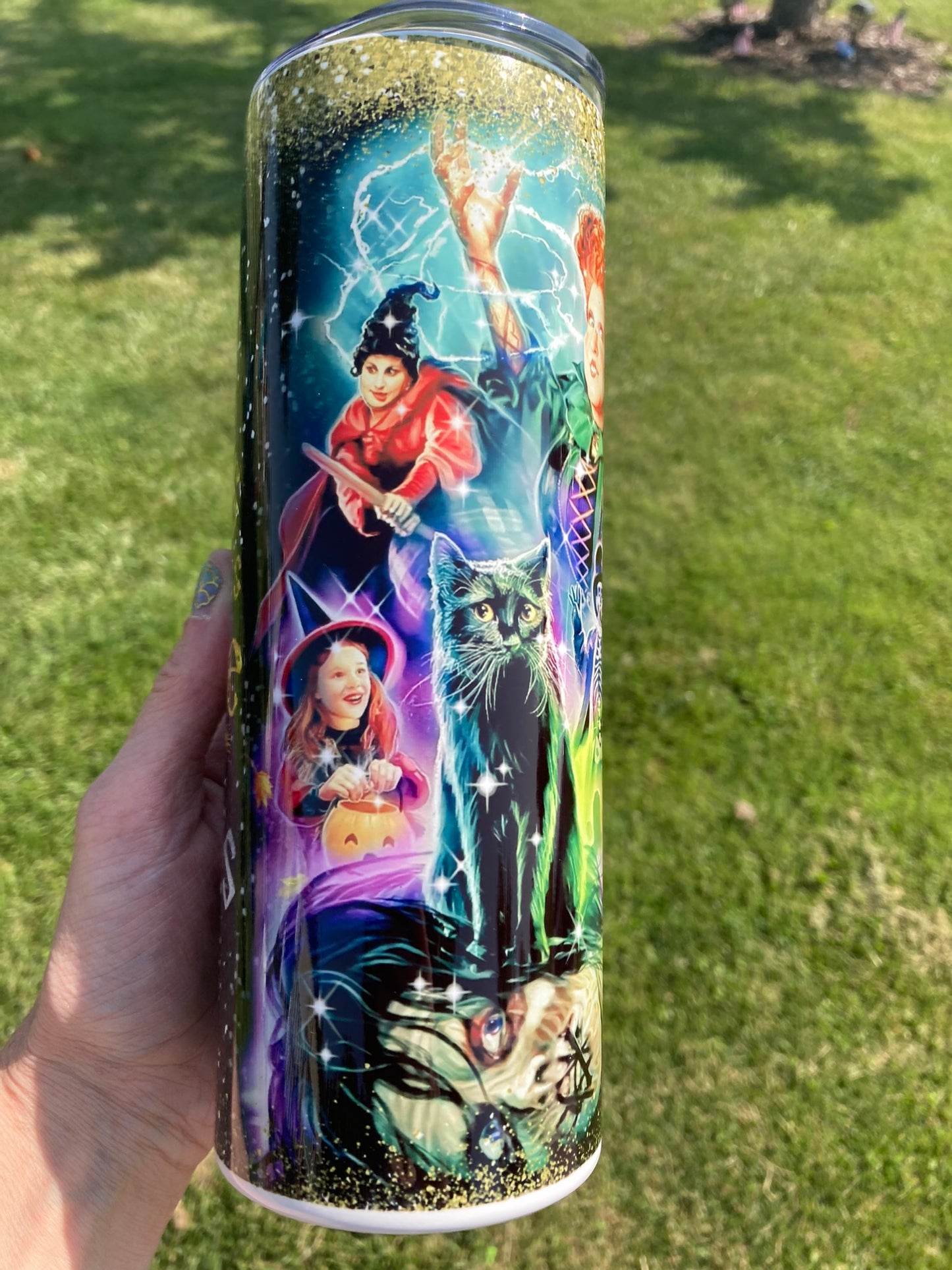 Hocus Pocus movie tumbler with witches, black cat, and colorful magical Halloween collage design