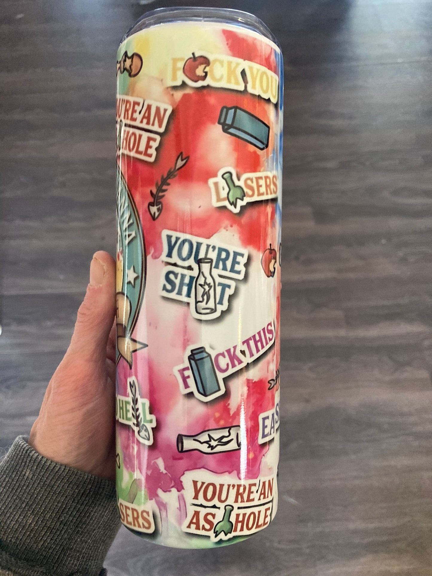Insulated 20oz skinny tumbler featuring a colorful raccoon trash panda with the words Talk Trash in a bold chaotic design 