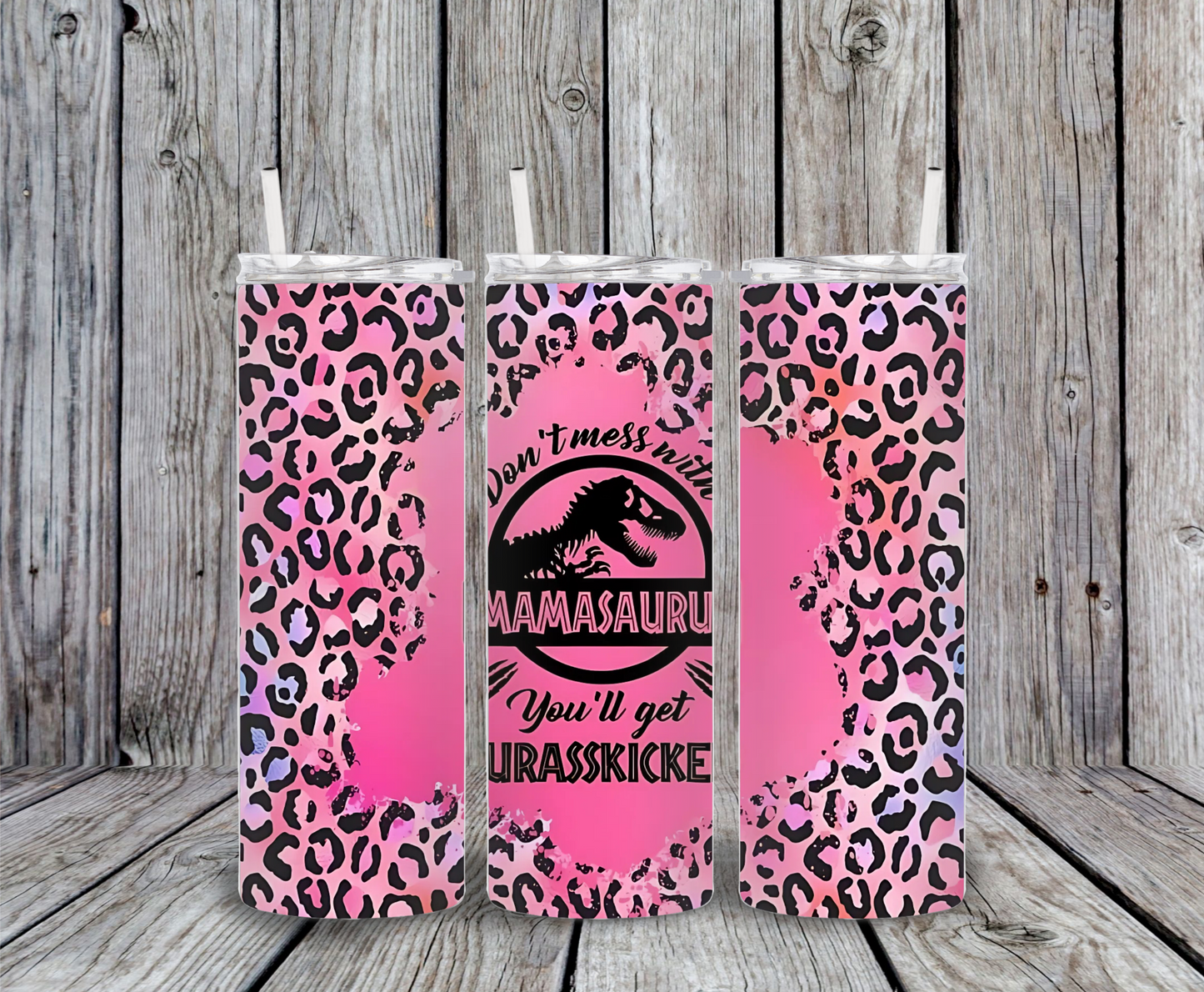 Funny mom tumbler – 20oz stainless steel insulated drinkware with dinosaur logo, sarcastic quote ‘Don’t Mess with Mamasaurus, You’ll Get Jurasskicked,’ pink leopard background.