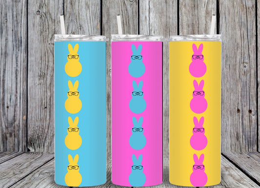 Bright 20oz skinny tumbler featuring vertical rows of colorful peep bunnies wearing glasses. MIRootsCreations