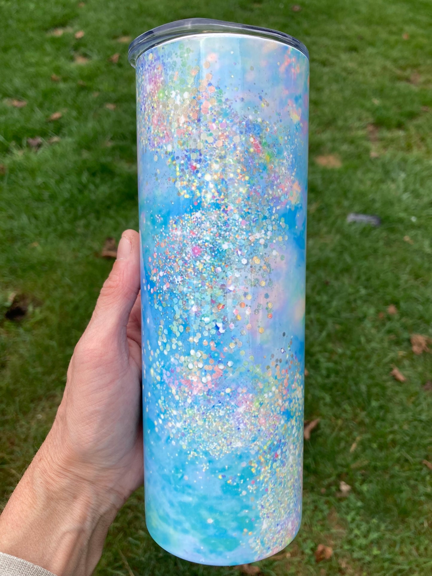 Pastel Glitter Galaxy 20oz Skinny Tumbler. 20oz tumbler with pastel blue and pink glitter galaxy swirl design.