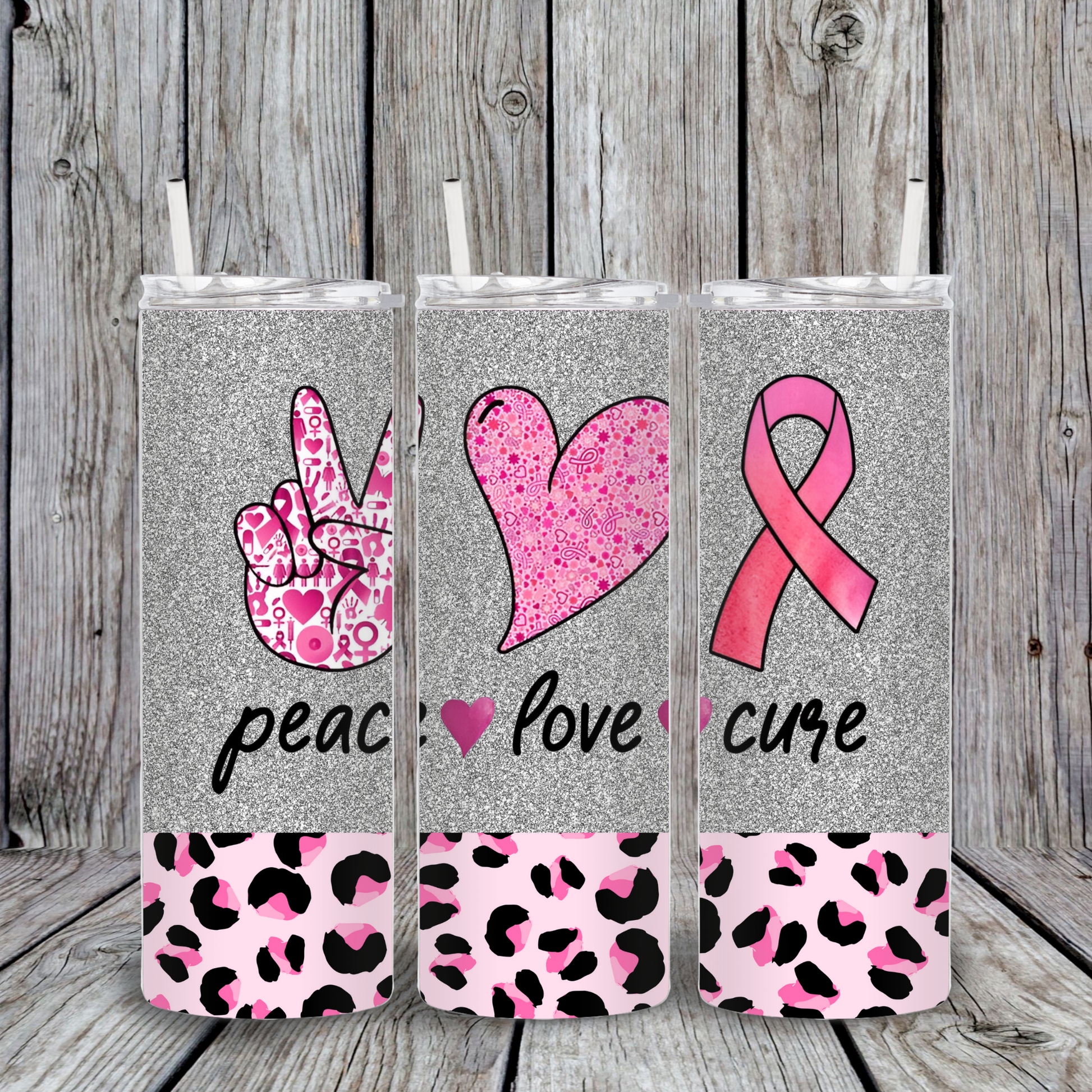 Silver glitter tumbler with pink ribbon, peace sign, and heart graphics with leopard print base. Breast Cancer Awareness design reading Peace Love Cure.