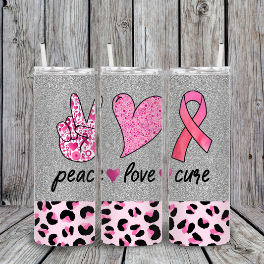 Silver glitter tumbler with pink ribbon, peace sign, and heart graphics with leopard print base. Breast Cancer Awareness design reading Peace Love Cure.