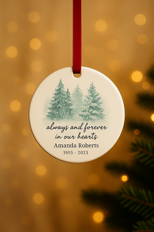 Memorial ornament with trees and text on a blurred golden background