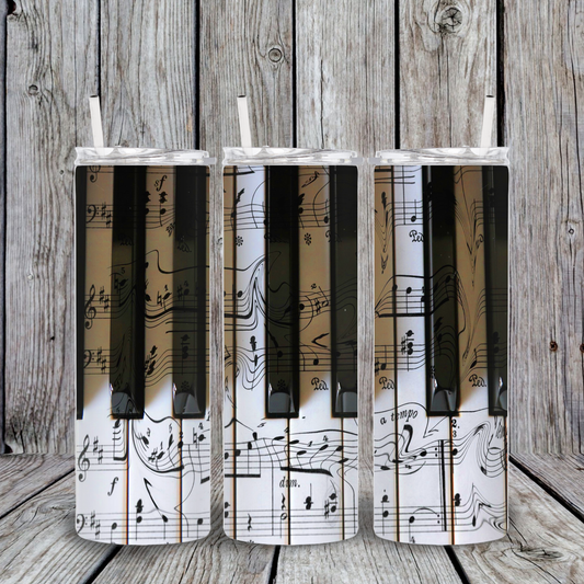 20oz stainless steel tumbler with realistic piano keys design layered over sheet music background.
