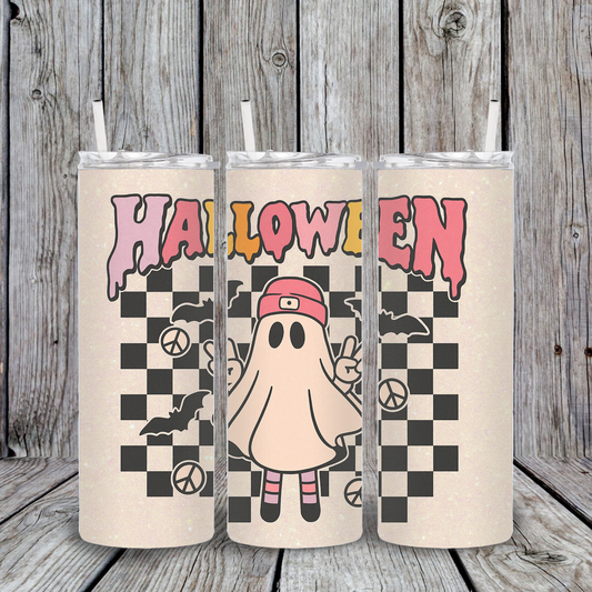 Three colorful Halloween-themed tumbler designs on a wooden background