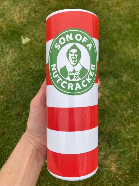 Red and white striped Christmas tumbler with “Son of a Nutcracker” funny holiday quote design