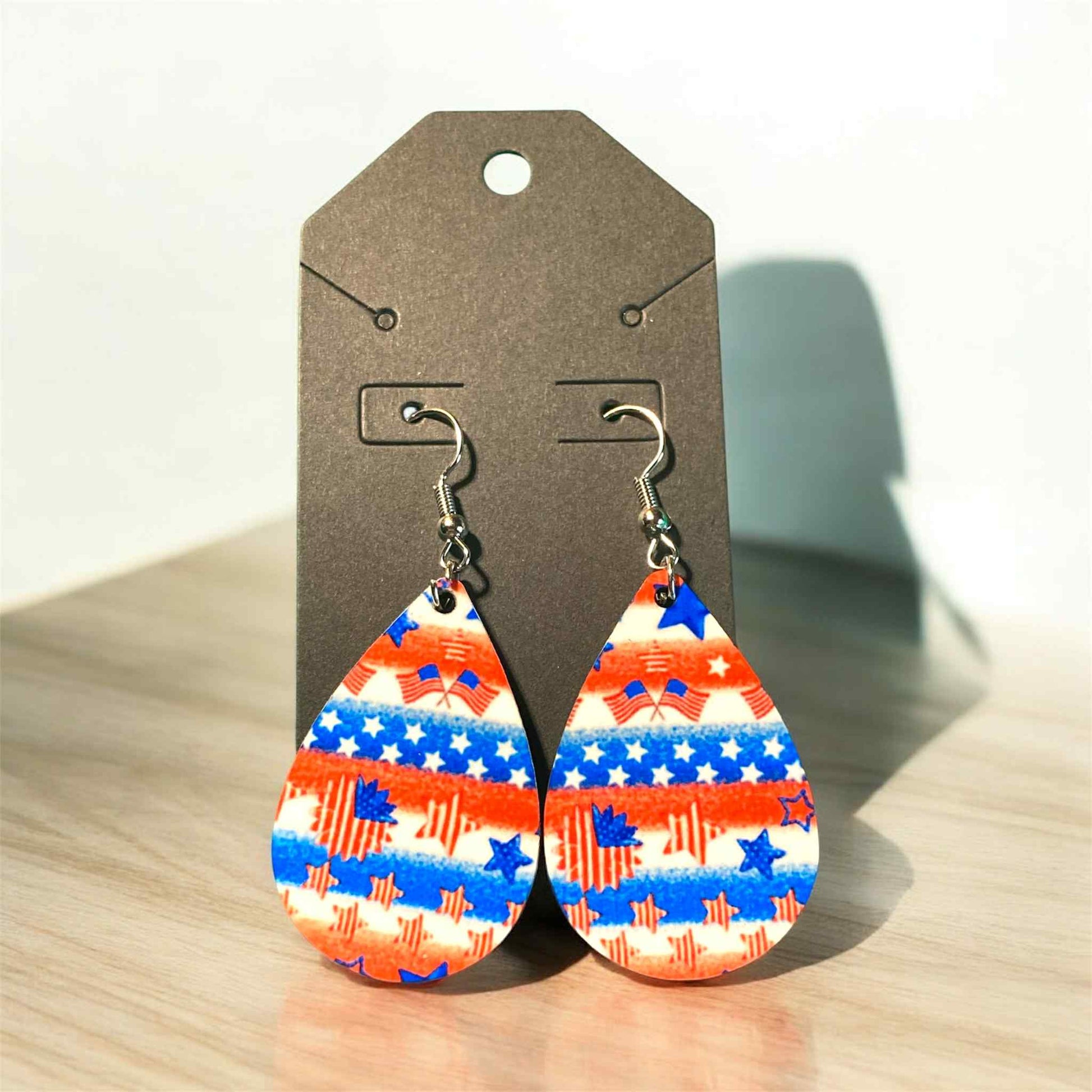 Lightweight teardrop earrings featuring red, white, and blue stars and stripes sublimation design.