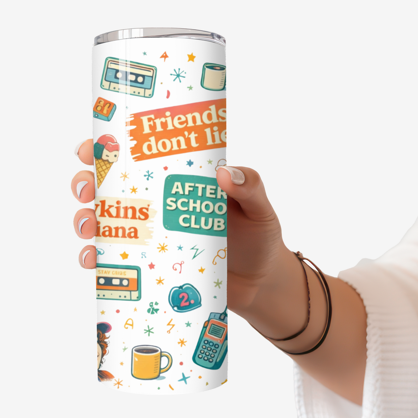 Hand holding a 20oz stainless steel tumbler featuring Stranger Things–inspired retro icons, phrases, cassette tapes, bikes, lights, and 80s sci-fi imagery.