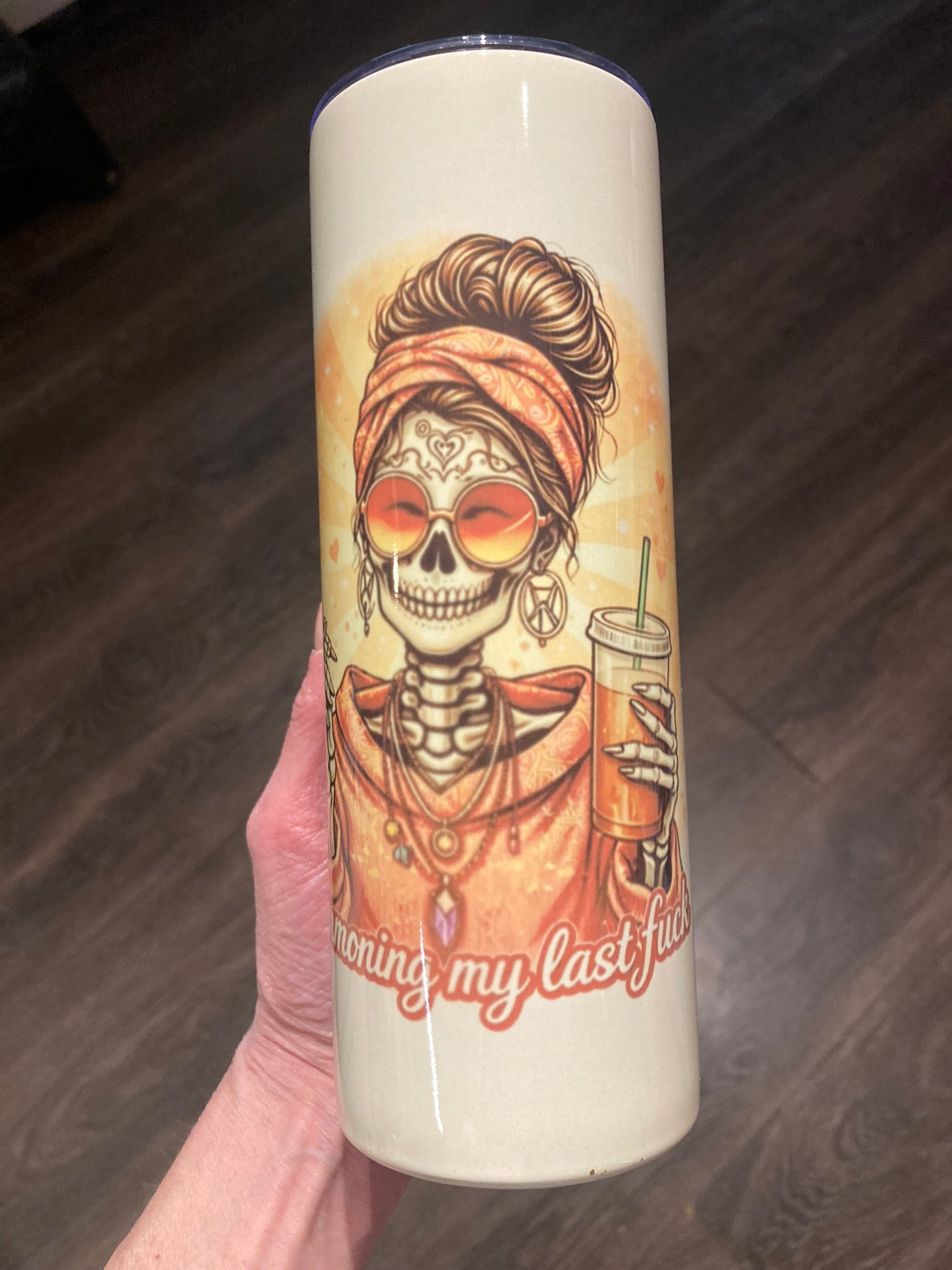 Skeleton woman wearing sunglasses holding a cigarette and iced coffee with “Summoning My Last Fuck” text on a 20 oz tumbler.