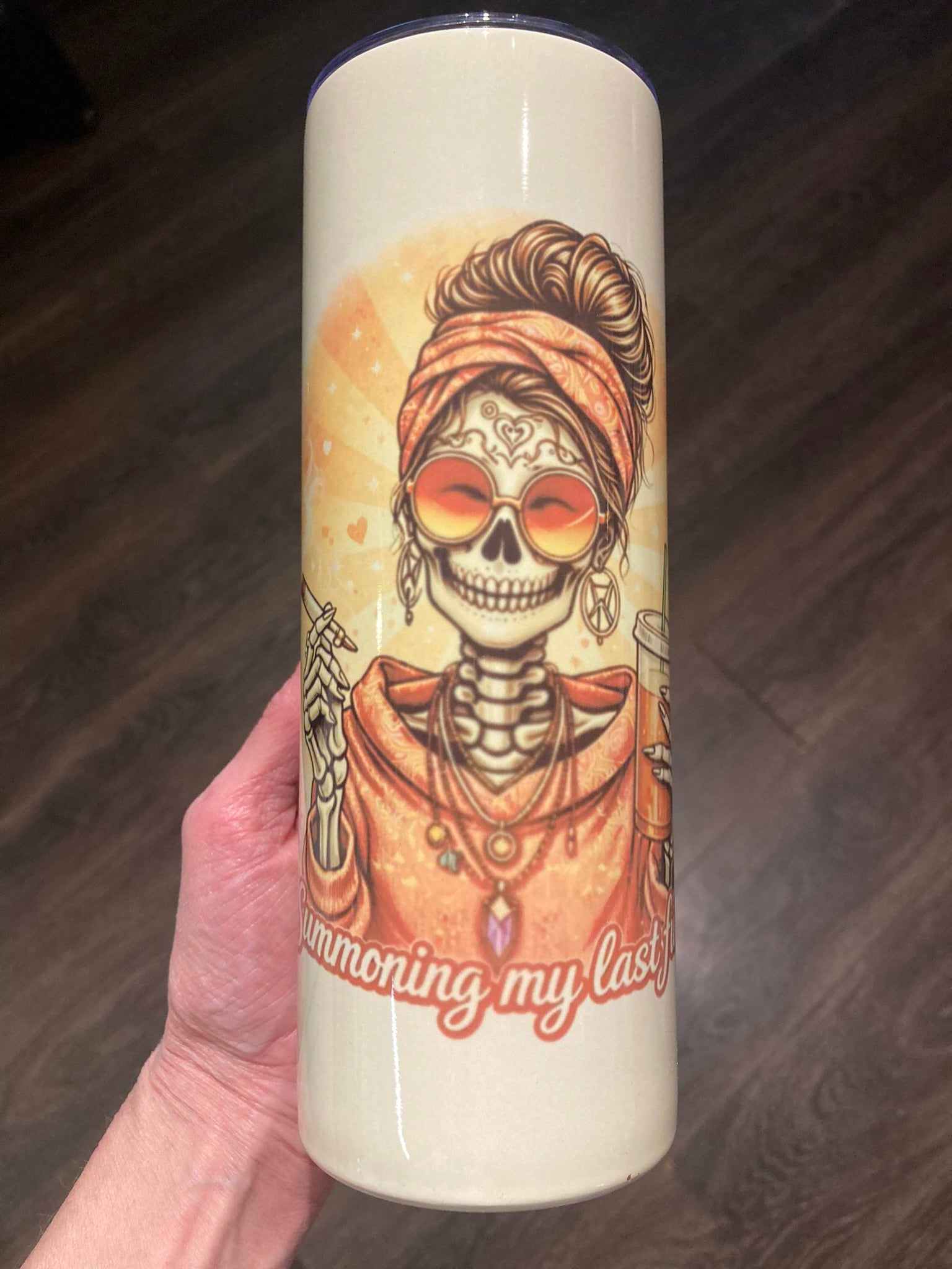Skeleton woman wearing sunglasses holding a cigarette and iced coffee with “Summoning My Last Fuck” text on a 20 oz tumbler.