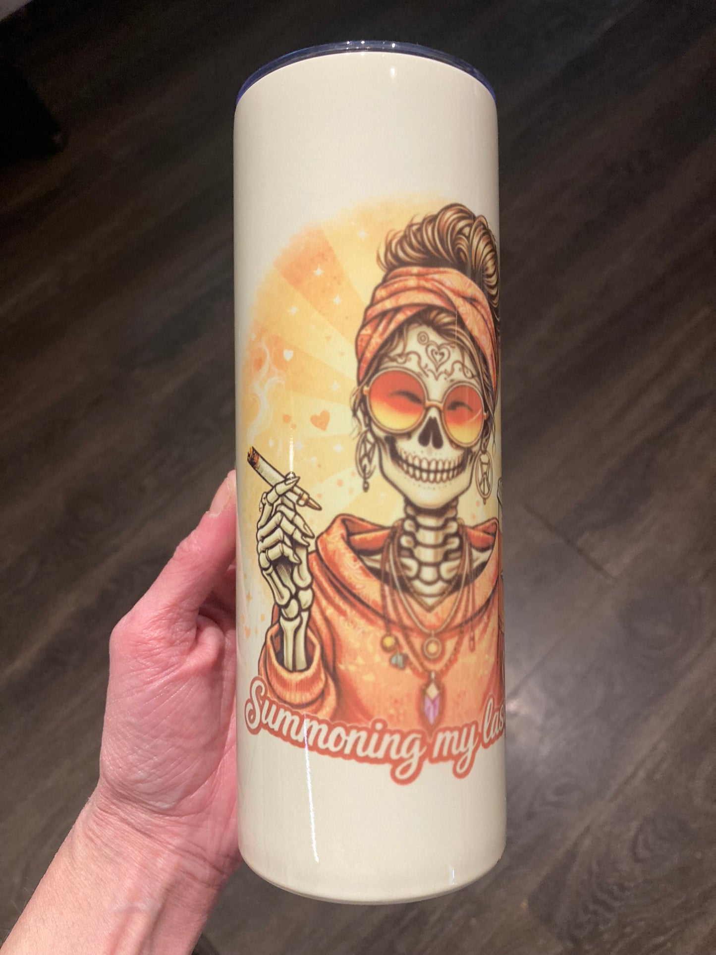 Skeleton woman wearing sunglasses holding a cigarette and iced coffee with “Summoning My Last Fuck” text on a 20 oz tumbler.