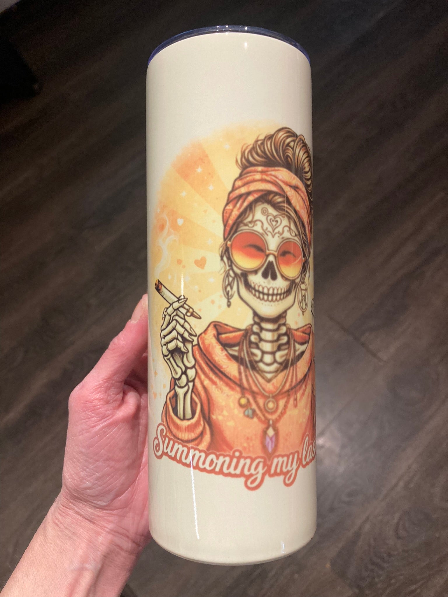 Skeleton woman wearing sunglasses holding a cigarette and iced coffee with “Summoning My Last Fuck” text on a 20 oz tumbler.