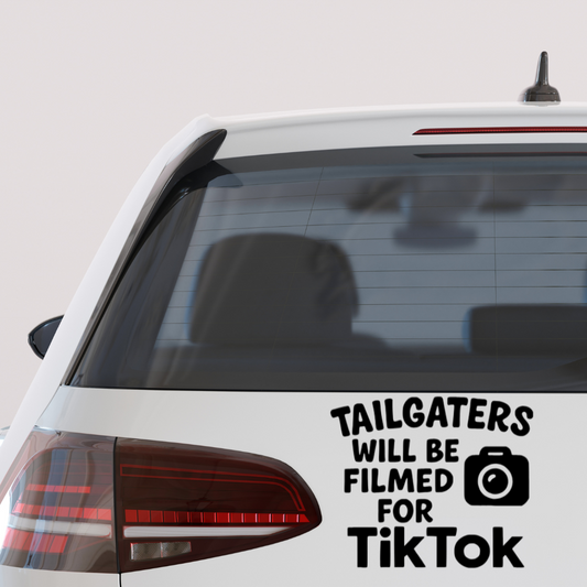 Vinyl car decal that says “Tailgaters Will Be Filmed for TikTok” with a camera icon.