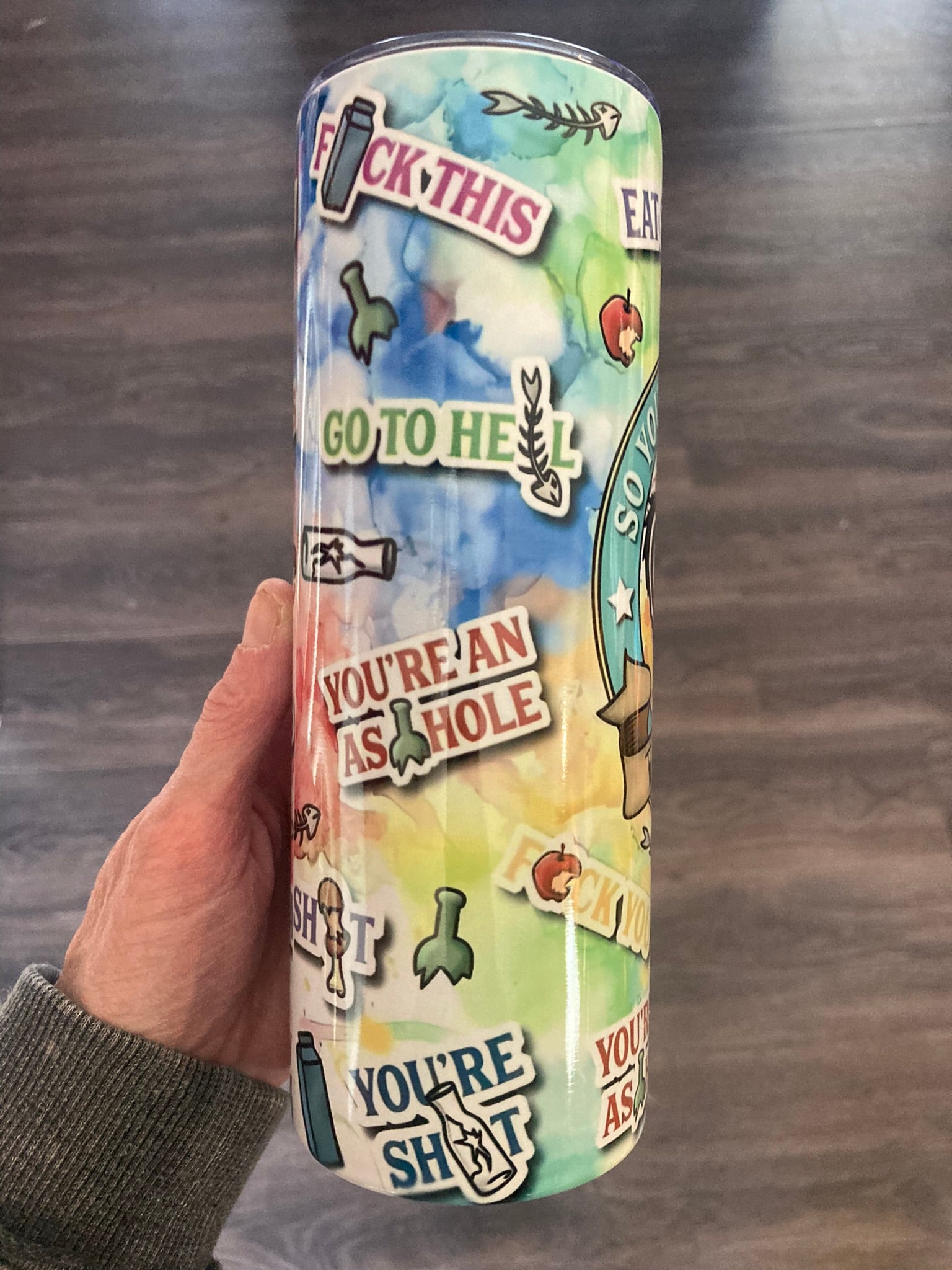 Insulated 20oz skinny tumbler featuring a colorful raccoon trash panda with the words Talk Trash in a bold chaotic design