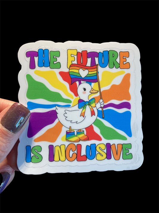 Sticker with a colorful design featuring a duck holding a rainbow flag and text 'The Future is Inclusive' on a black background.
